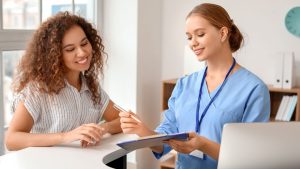 wellness center employee showing client document